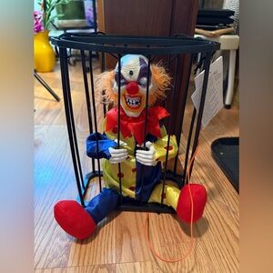 NWT Halloween animatronic decoration of a clown in a cage.Its motion activated.